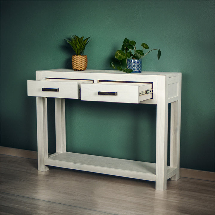 Vancouver 2 Drawer White Pine Hall Table front view with its two drawers open. There are two potted plants on top.
