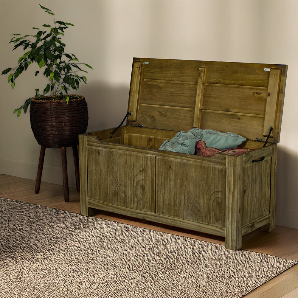 The front of the Vancouver NZ Pine Blanket Box with the top open. There is a free standing potted plant next to it.