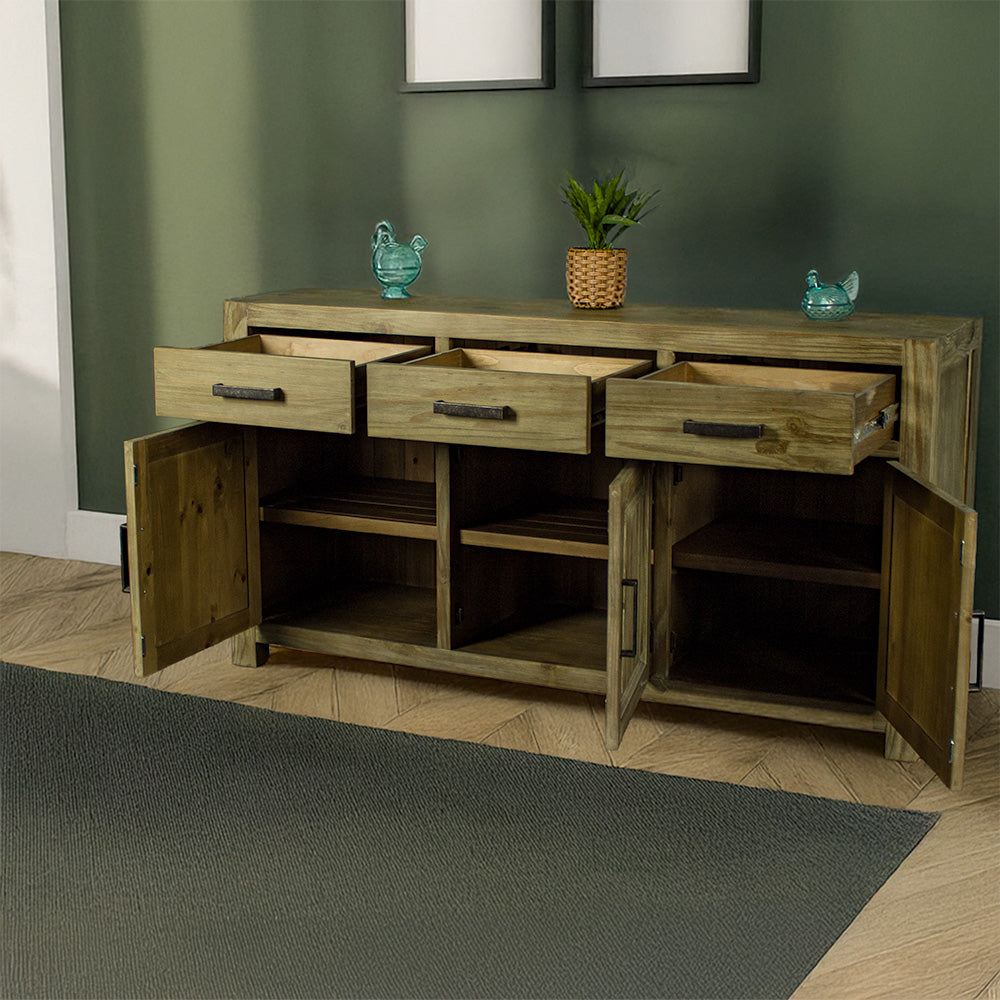 The front of the Vancouver Large NZ Pine Buffet with its drawers and doors open. There are two blue glass ornaments on top with a potted plant in the middle.