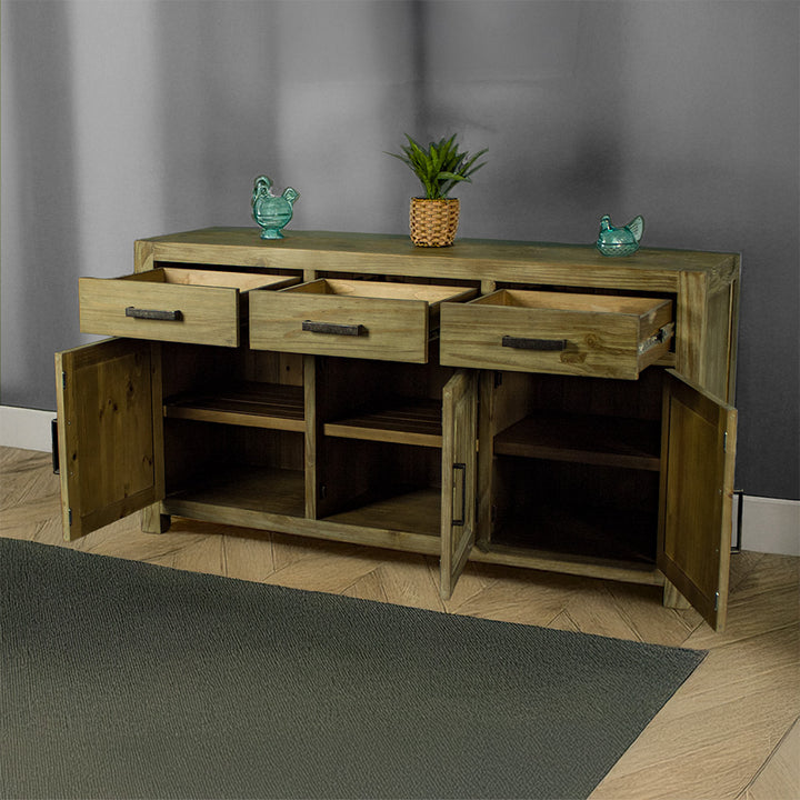 The front of the Vancouver Large NZ Pine Buffet with its drawers and doors open. There are two blue glass ornaments on top with a potted plant in the middle.