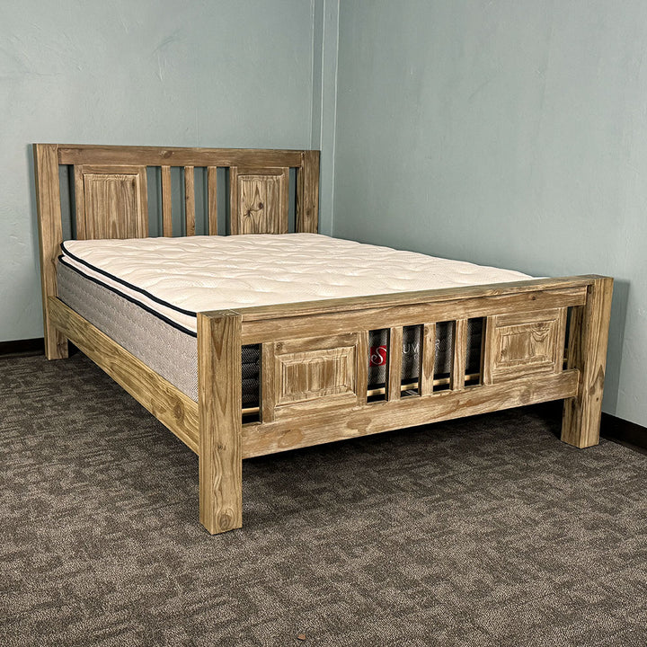 The front of the Vancouver Queen Size NZ Pine Slat Bed Frame with a mattress on top.