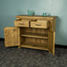 The front of the Ventura Recycled Pine Buffet with its drawers and doors open. There are two blue glass ornaments on top.