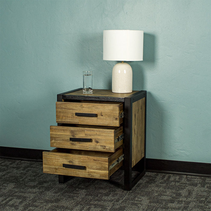 Front of the Victor 3 Drawer Bedside Cabinet with its drawers open. There is a glass of water and a lamp on top.