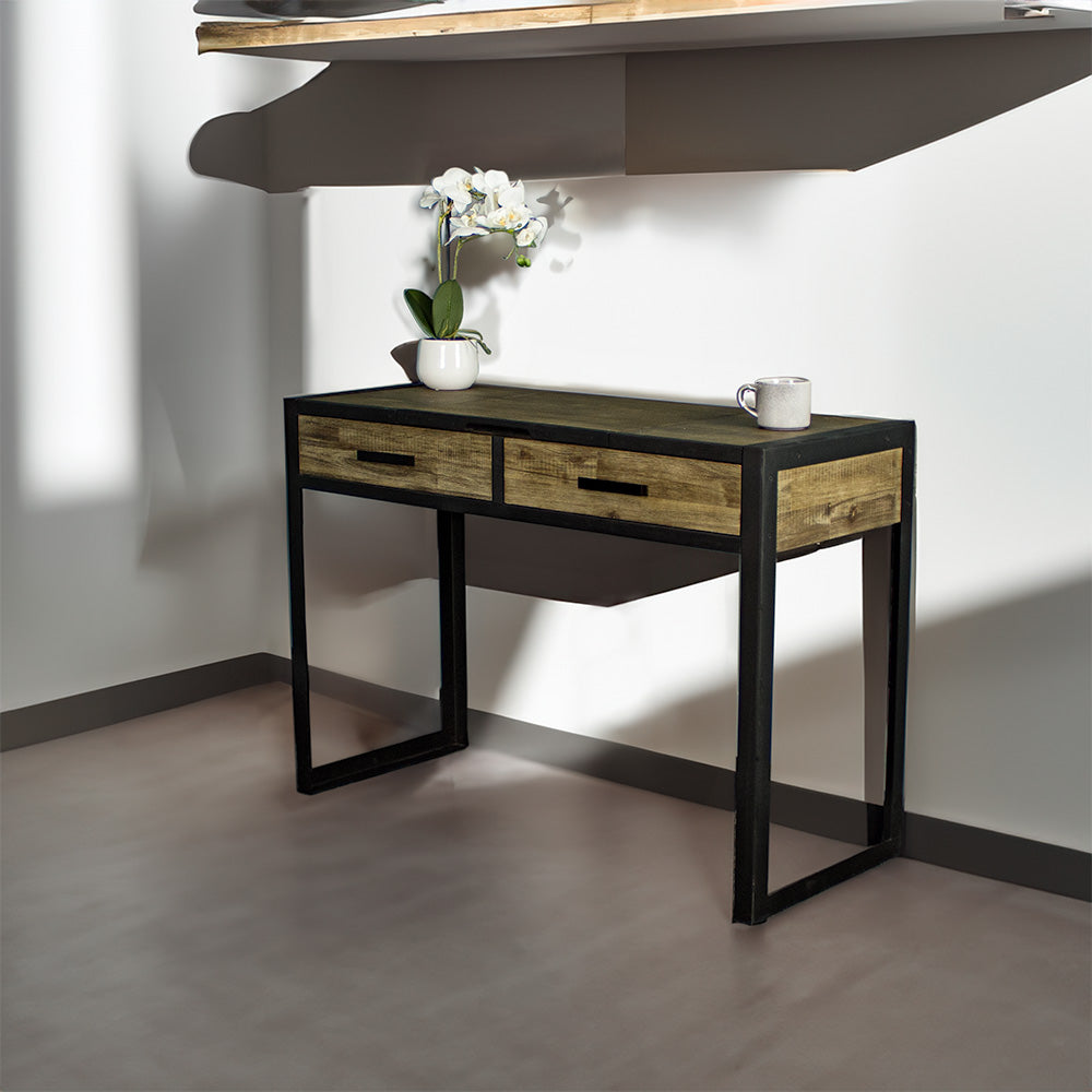 The front of the Victor Dressing Table / Desk with its drawers closed. There is a small pot of white flowers and a coffee cup on top.