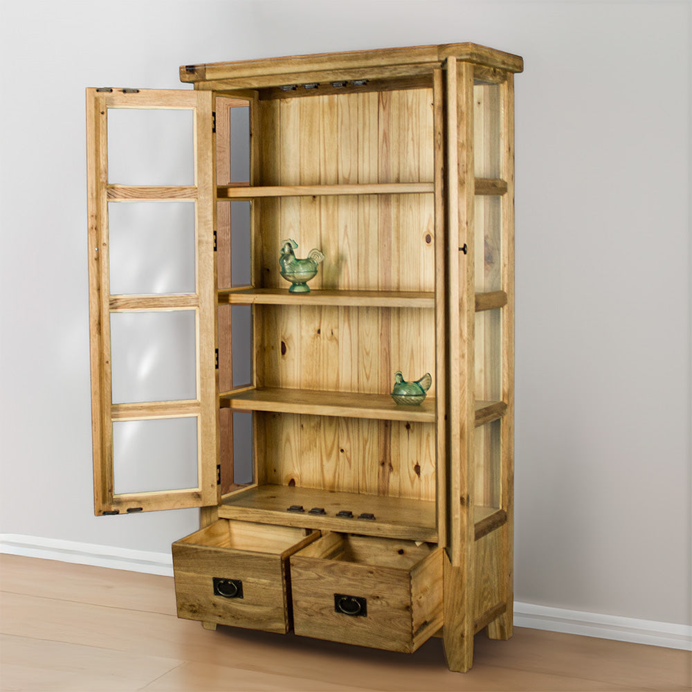 The front of the Vienna Oak Glass Display Cabinet with its doors and drawers open. There are two blue glass ornaments on the middle two shelves.