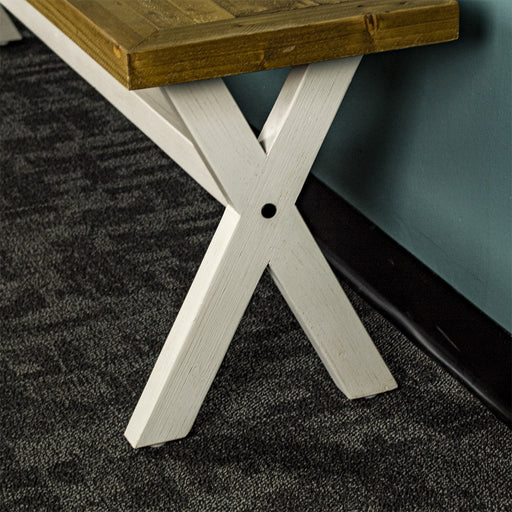 The cross leg design of the Byron Recycled Pine Bench which provides stability