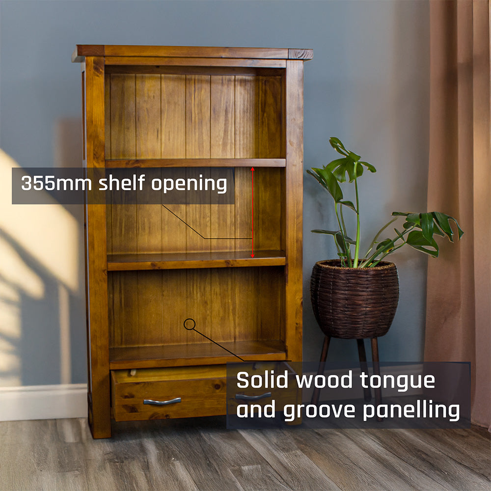 The front of the Monaco Bookcase with its drawers open. There is a free standing potted plant next to it.