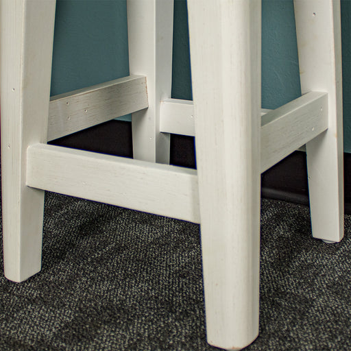 A closer view of the legs of the Byron Recycled Pine Stool.
