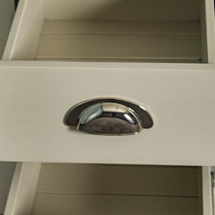 Close up of the metallic chrome curved handle of the drawer for the Alton 3 Drawer Pine Bedside Cabinet