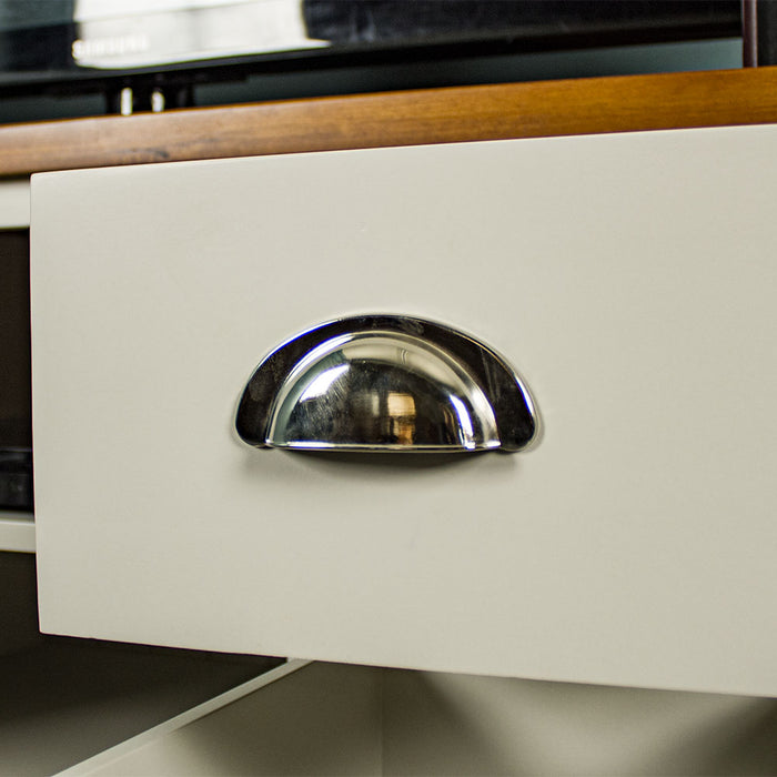 A close up of the silver mirror handle on the drawers of the Alton Entertainment Unit.