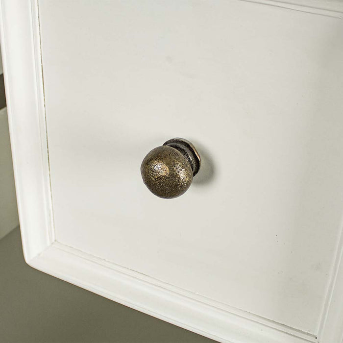 A close up of the brushed brass metal handle on the drawers of the Biarritz 7 Drawer Tallboy / Chest of Drawer