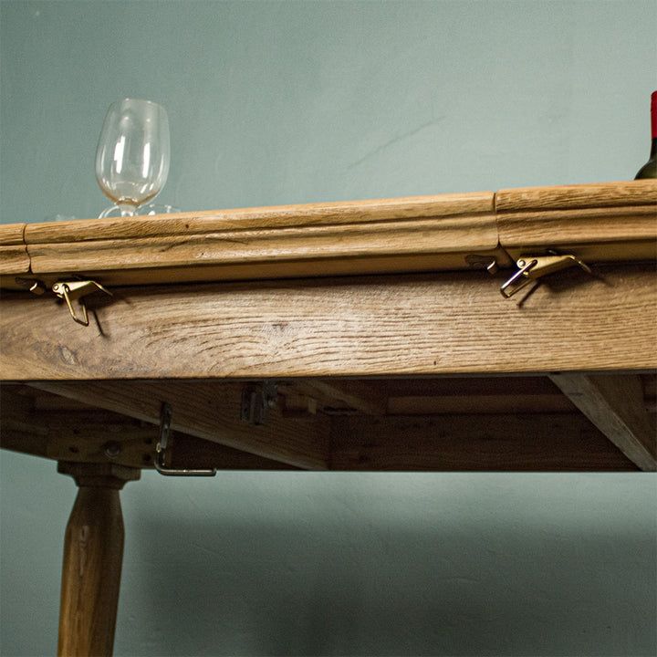 The mid section of the Boston Oak Extending Dining Table - Natural Oak with a brief view of the underside.