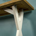 Close up of the attached cross legs to the top of the Byron Recycled Pine Console Table, with support bars on either side.