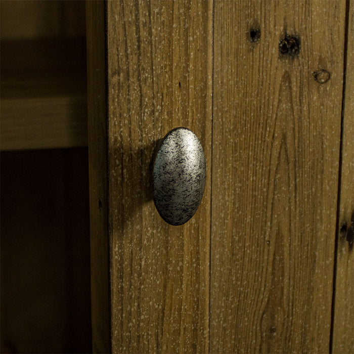 A close up of the brushed metal handle on the Cairns Recycled Pine Buffet