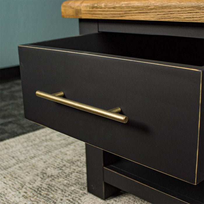 A close up of the gold coloured metal handle on the drawer of the Cascais 2 Drawer Coffee Table.