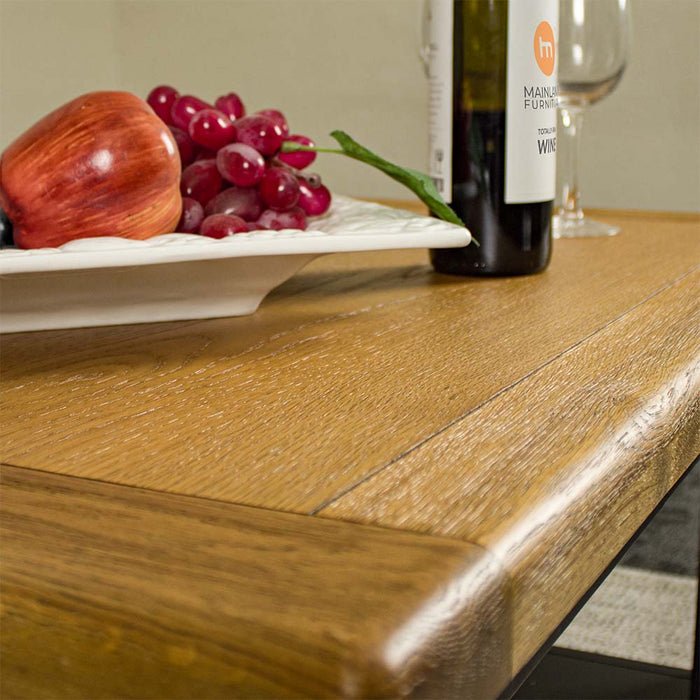 A close up of the top of the Cascais Oak-Top Coffee Table, showing the wood grain and colour.