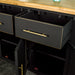 Close up of the gold metal handle on the drawer of the Cascais Large Black Buffet.