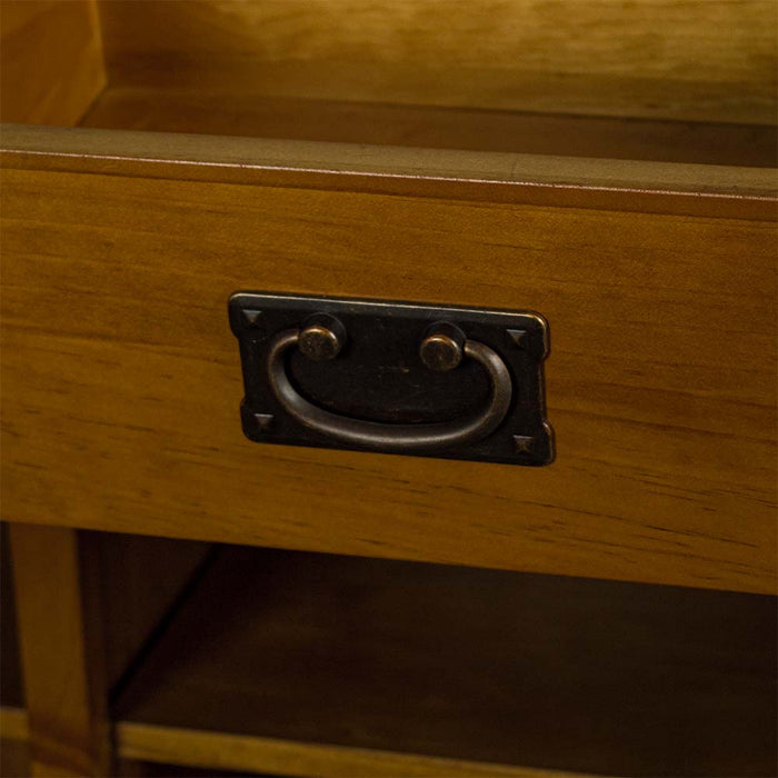 A close up of the black hanging style handle on the drawer of the Rimu stained Montreal 2 Drawer Pine Buffet.
