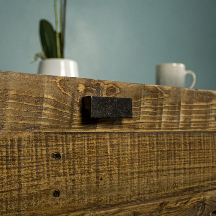 Close up of the black metal handle of the Nova Recycled Pine Coffee Table