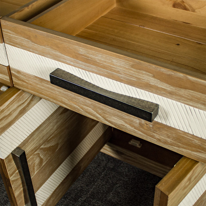 A close up of the black metal handle on the drawers of the Soho 3 Drawer NZ Pine Large Buffet