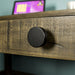 Close up of the black circular handle on the Stonemill Recycled Pine Desk