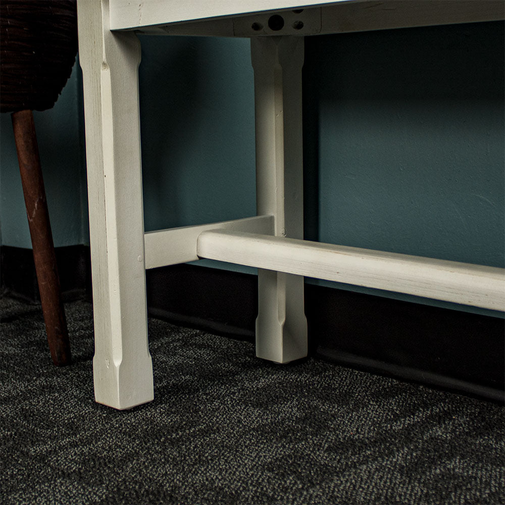 Close up of the support bar connecting to the legs of the Tuscan Recycled Pine Bench