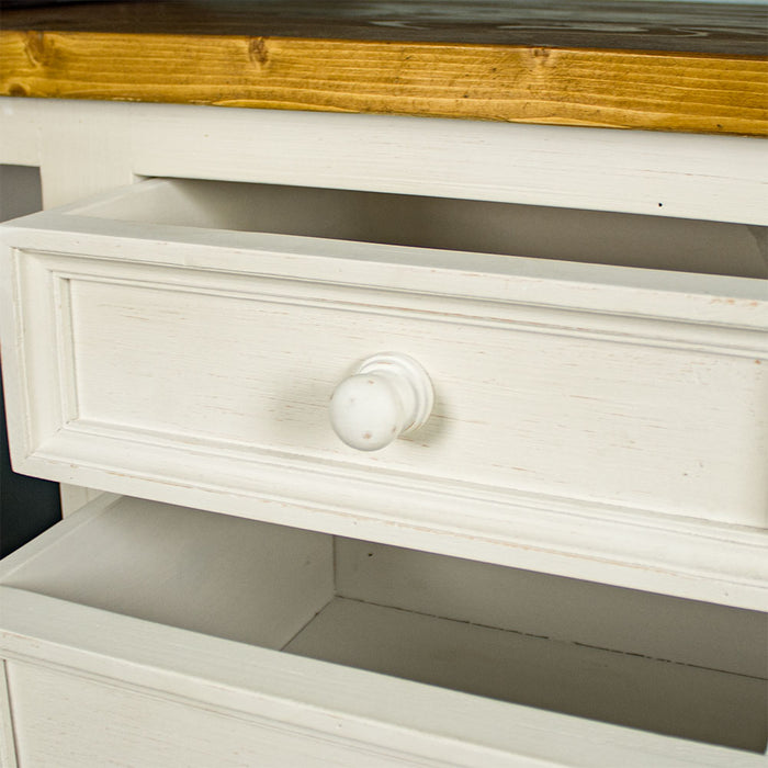 A close up of the doorknob style handle on the drawers of the Tuscan Recycled Pine Small Desk.