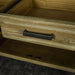 A close up of the brushed black metal handle on the drawers of the Vancouver Pine Buffet.