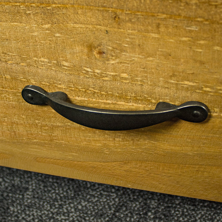 A close up of the black metal handle on the drawers of the Ventura Two Drawer Recycled Pine TV Unit.