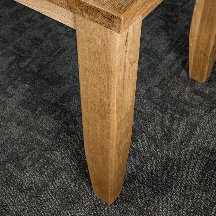 A closer view of the leg of the Yes Oak Dining Table (1.4m)