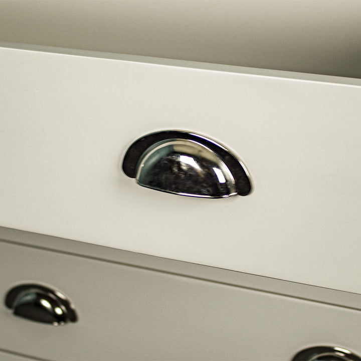 A close up of the chrome/silver handle on the drawers of the Alton 6 Drawer NZ Pine Tallboy