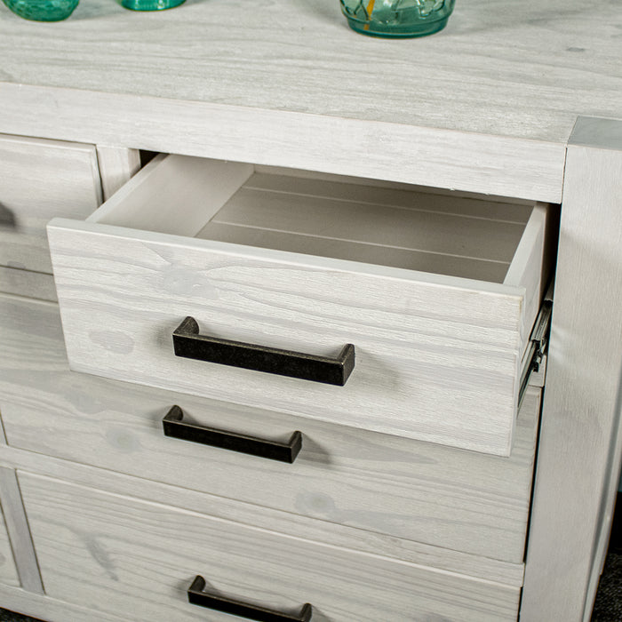 A close up of the black metal handle on the Vancouver 7 Drawer White Lowboy