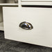 Close up of the chrome metal curved handle on the white Alton 2 Door 5 Drawer Buffet