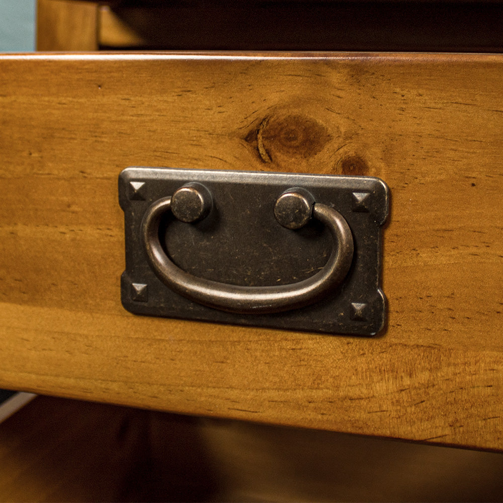 A close up of the handle on the drawers of the Montreal Pine Bedside Cabinet