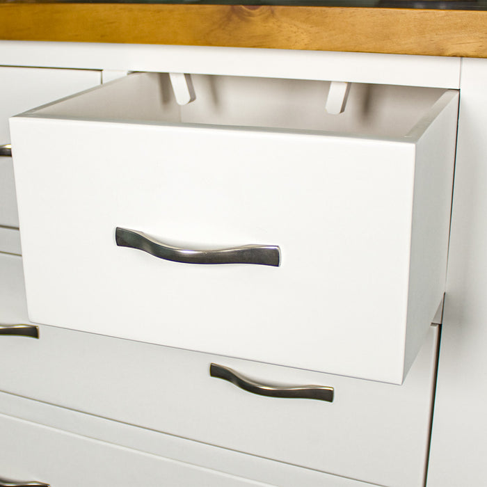 A close up of the silver metal handle on the Felixstowe 5 Drawer Pine Tallboy.