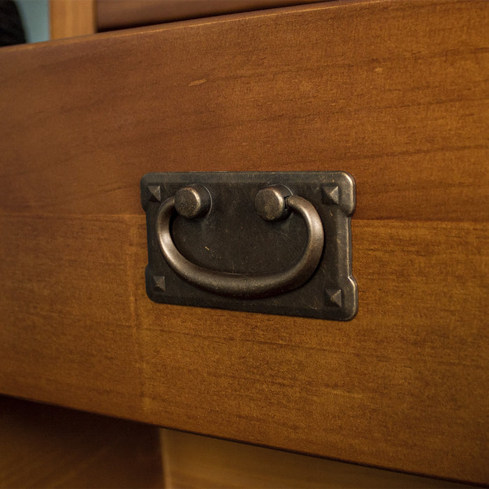 A close up of the brushed black metal handle on the drawers of the Montreal 7 Drawer Pine Lowboy