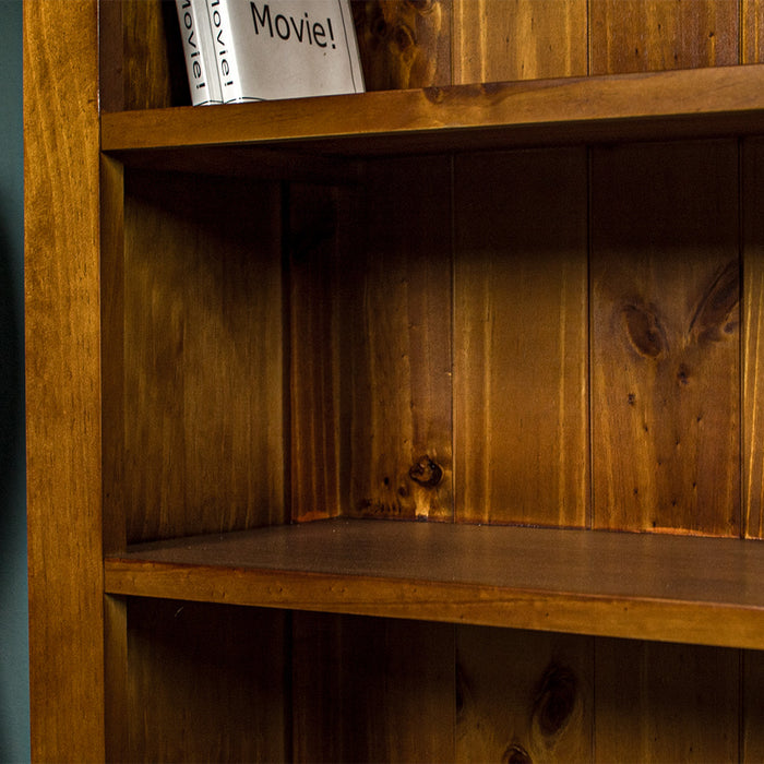 A close up of the middle shelf on the Montreal Short Pine Bookcase