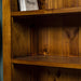 A close up of the middle shelf on the Montreal Short Pine Bookcase