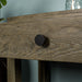 Close up of the black circular handle on the drawer of the brown Stonemill Recycled Pine Hall Table.