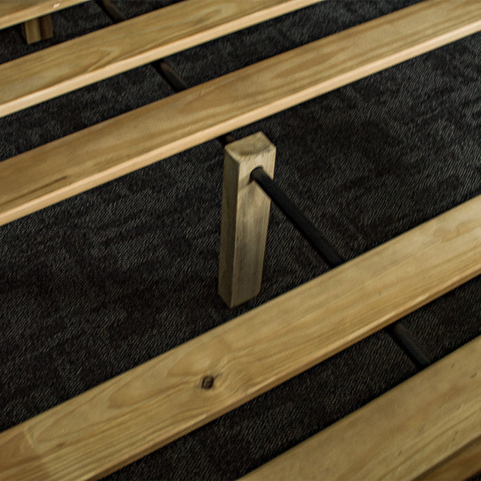 A close up of the wooden support legs that hold on to the metal support bar of the Amalfi Super King Oak Bed Frame.