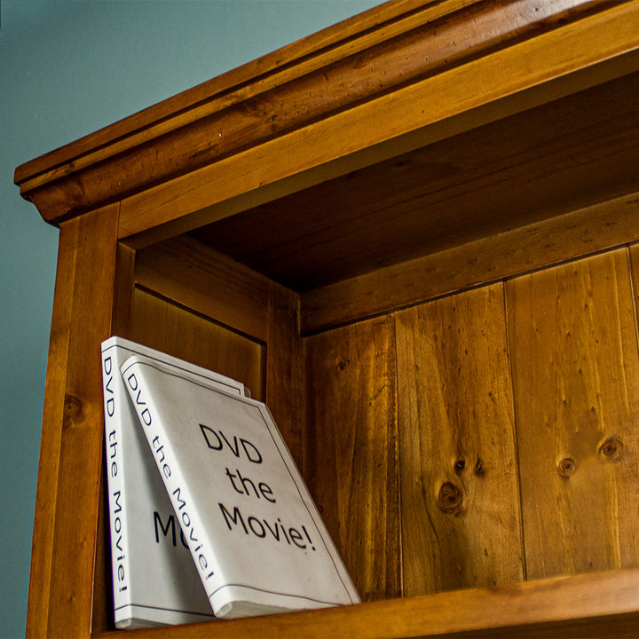 A high angle view of the top shelf on the Montreal Large Pine Bookcase