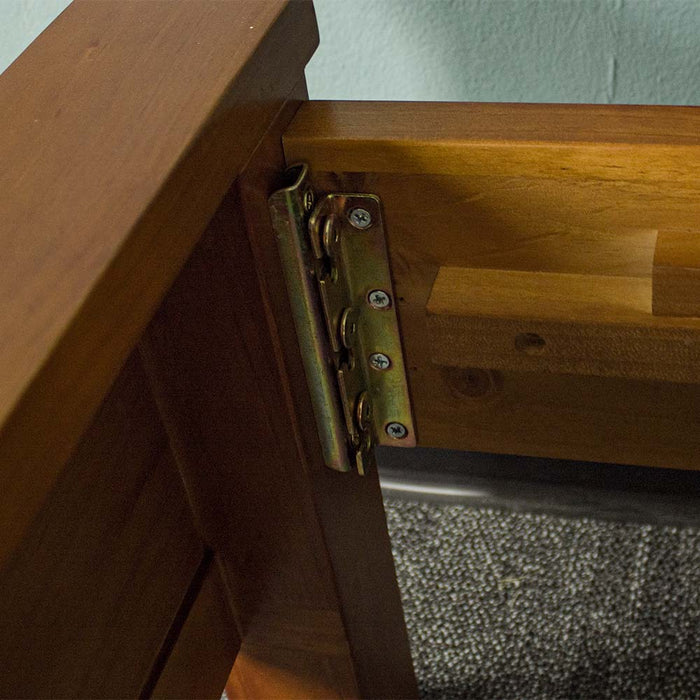 A close up of the bolts that securely hold the side rails to the headboard and footboard of the Alton Rimu-Stained NZ Pine King Bed Frame.