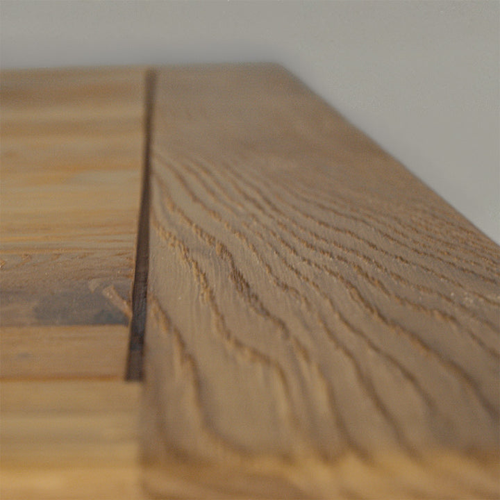 A close up of the top of the Amstel Square Oak Coffee Table, showing the wood grain.