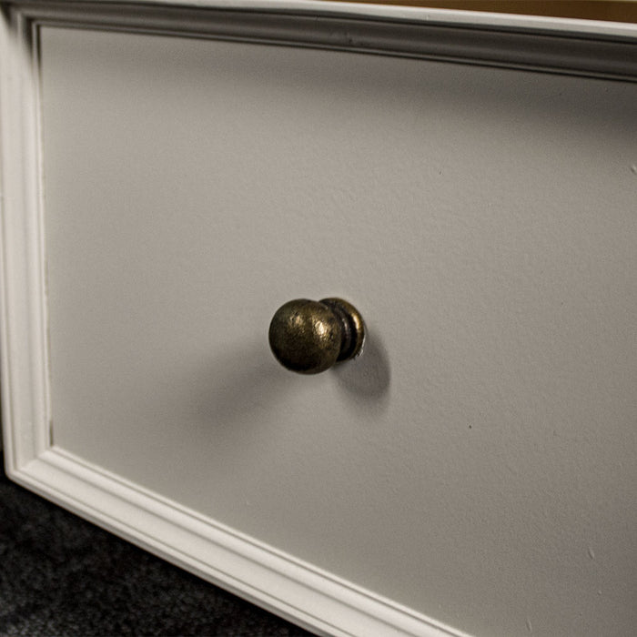 A close up of the brushed brass handle on the Biarritz 4 Drawer Extra-Large Coffee Table.