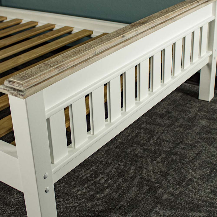 The footboard of the Biarritz Two-Tone Queen Size Slat Bed Frame.