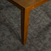 An overall view of the leg of the Hamilton Square Pine Dining Table (1m)