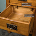 An overall view of the drawers on the Montreal Pine Bedside Cabinet.