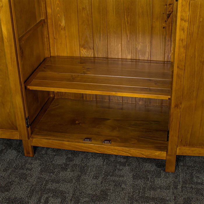 The lower shelf of the Montreal Full Length Pine Wardrobe which is adjustable