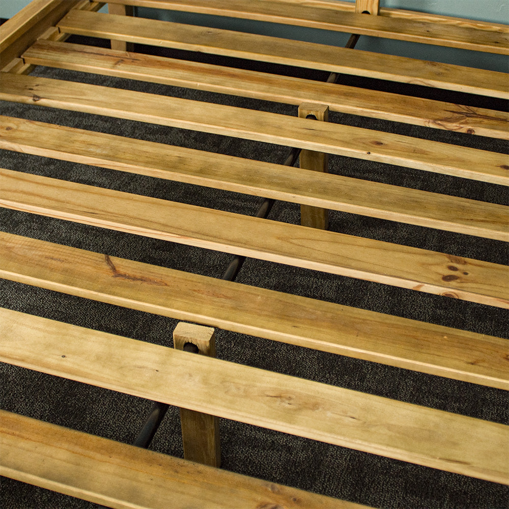 A close up of the slats and support beam on the Ormond Oak Double Bed Frame.