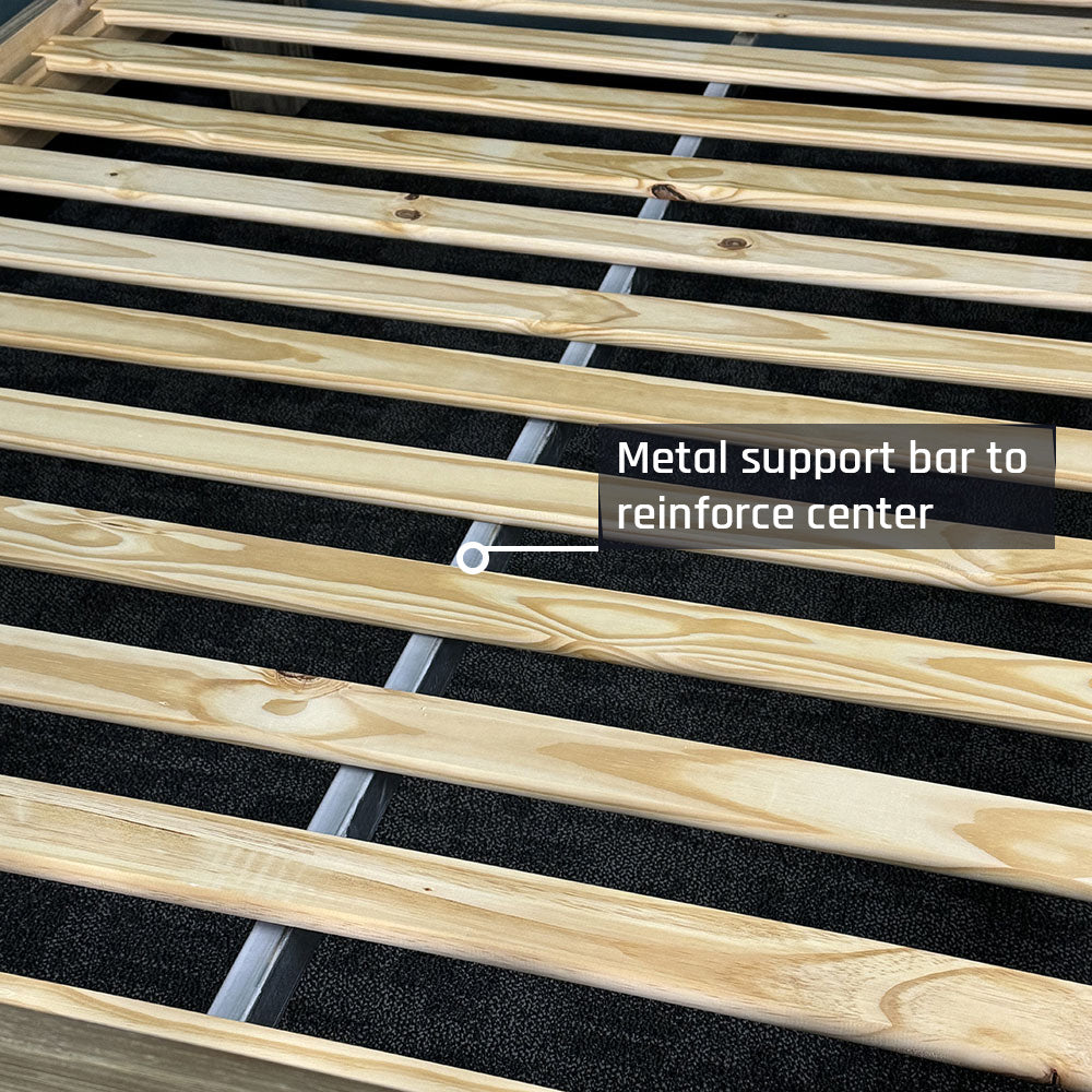 A close view of the slats on the Vancouver King Size Slat Bed Frame, with a metal support bar running underneath.